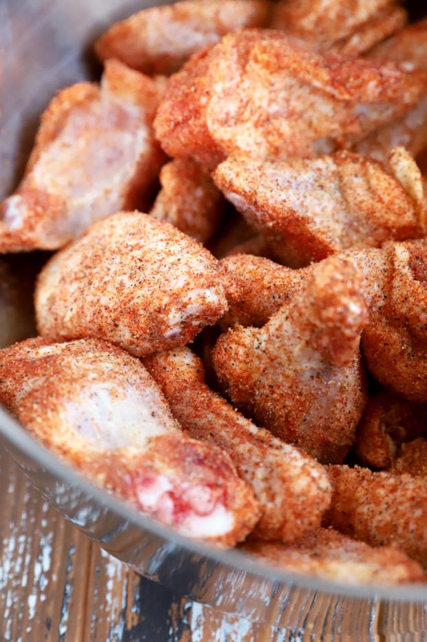 Dry rub on chicken wings in bowl image