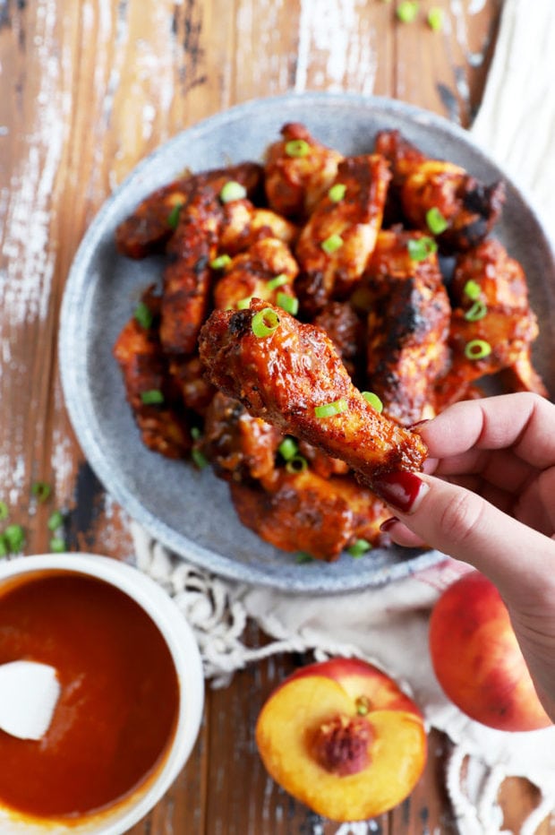 Hand holding bbq grilled wing picture