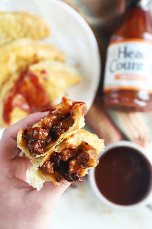 Hand holding air fryer empanadas image