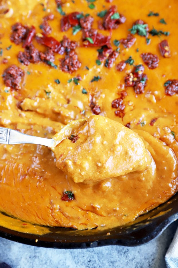 Dipping spoon in queso image