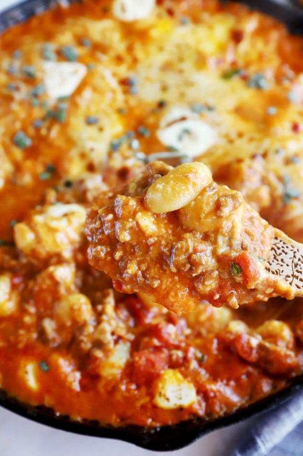 Spooning out pumpkin gnocchi bake image