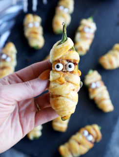 Hand holding jalapeno mummy popper image