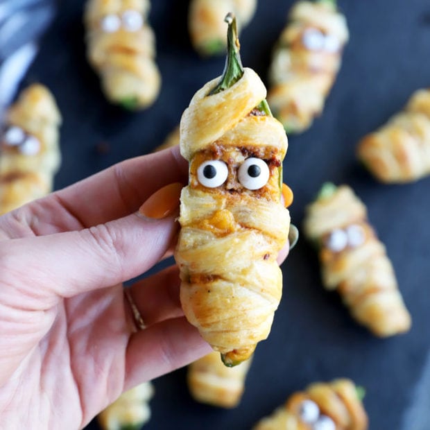 Hand holding jalapeno mummy popper image