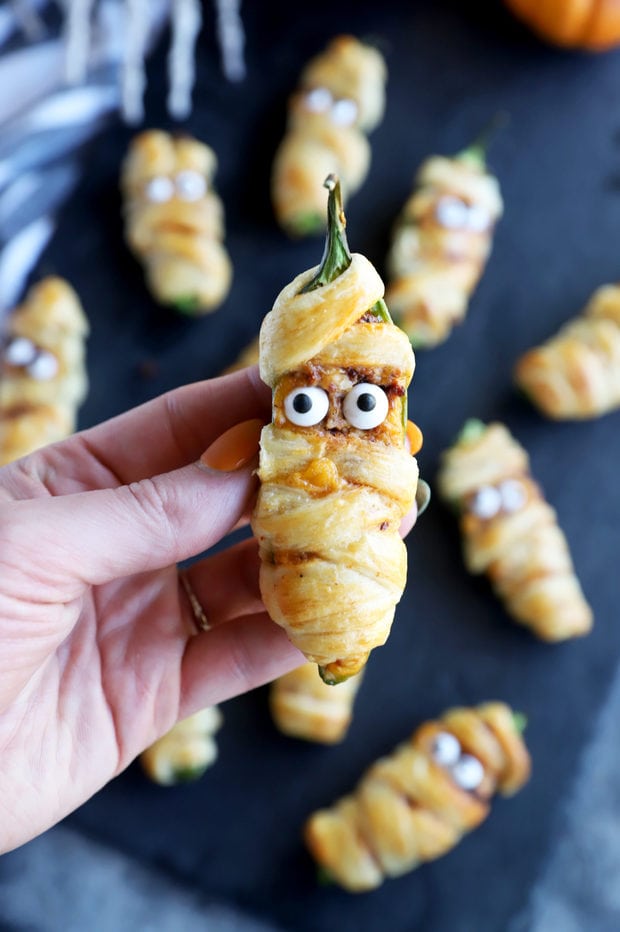 Hand holding jalapeno mummy popper image