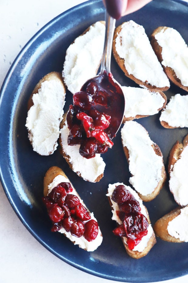 Adding cranberries to crostini image