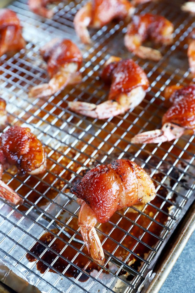 bacon wrapped shrimp on baking sheet image