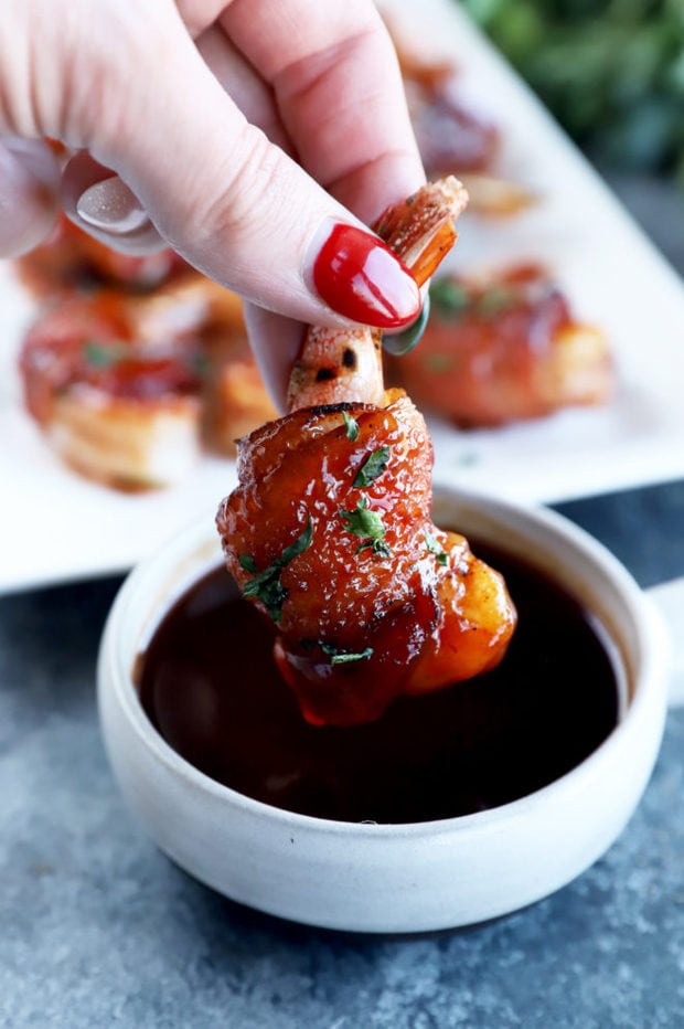 Dipping a shrimp in BBQ sauce image