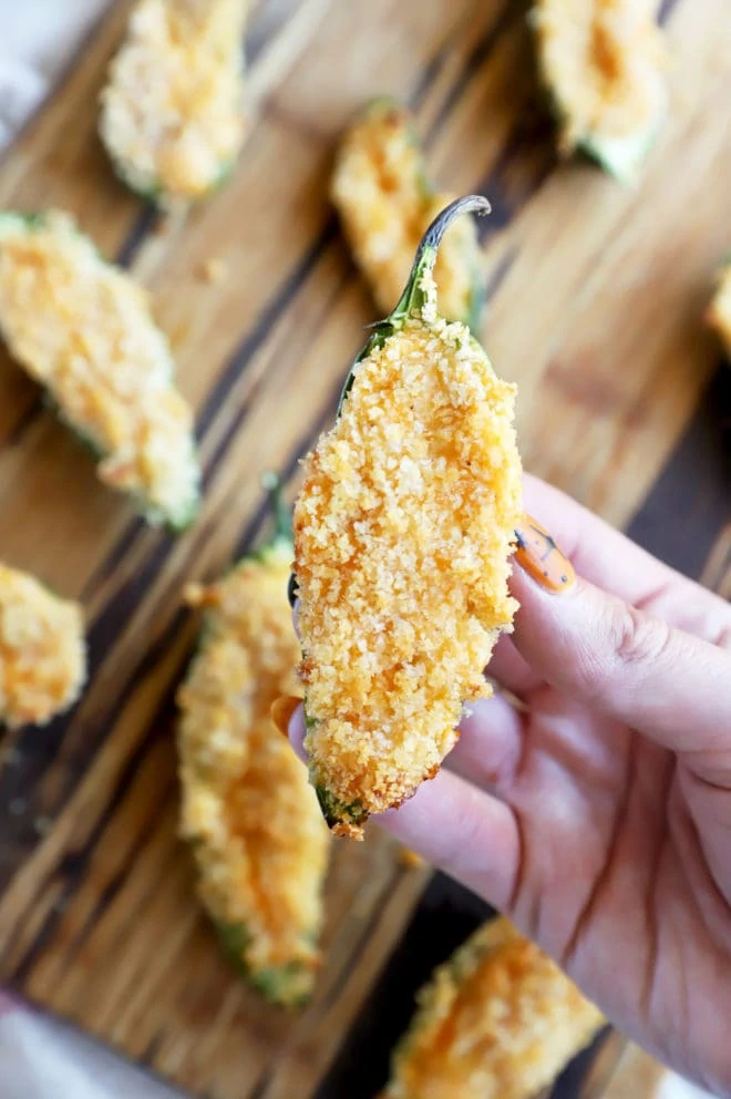 Hand holding air fryer buffalo jalapeno popper