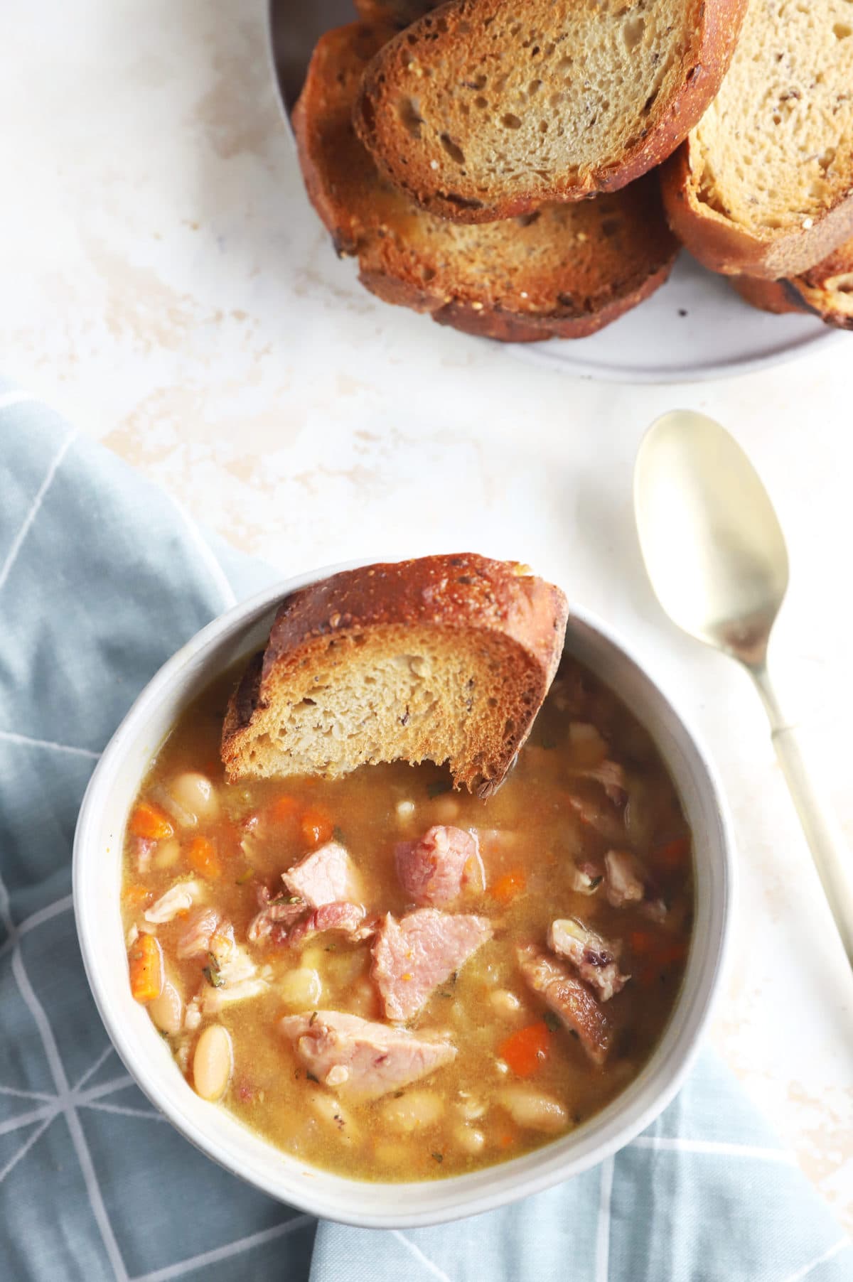 Overhead photo of soup in bowl with bread