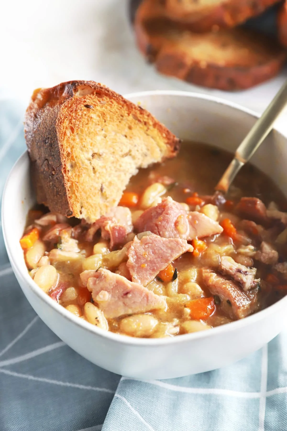 Side photo of ham and bean soup in bowl