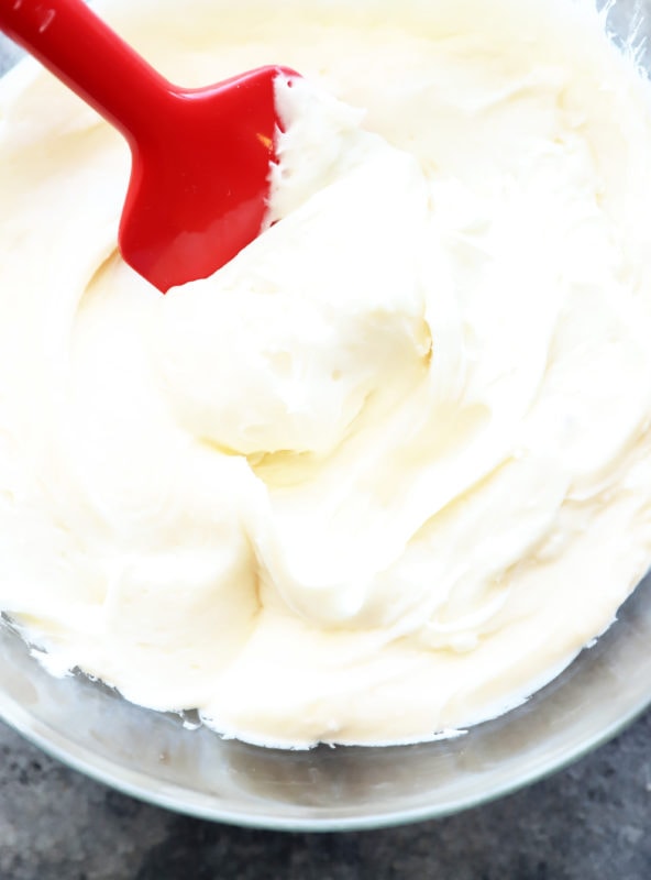 Cream cheese frosting in bowl with spatula image