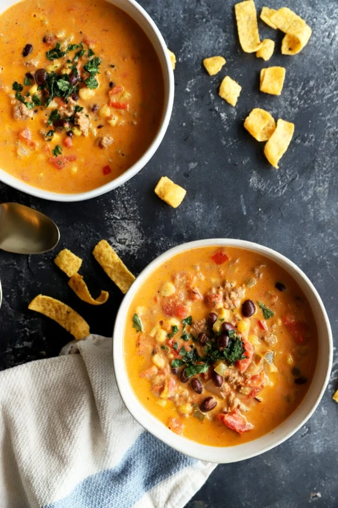 Overhead picture of chili in bowls with spoons