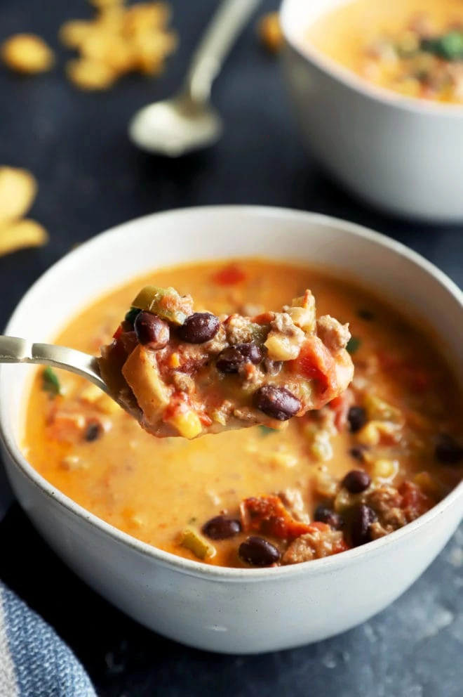 Spoon lifting out queso chili image