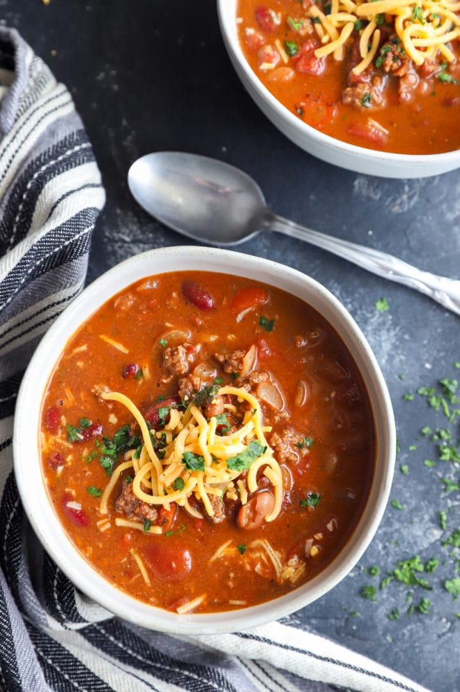 Overhead picture of soup in bowls with a spoon