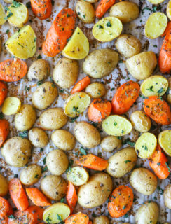 Overhead photo of potatoes and carrots on a sheet pan
