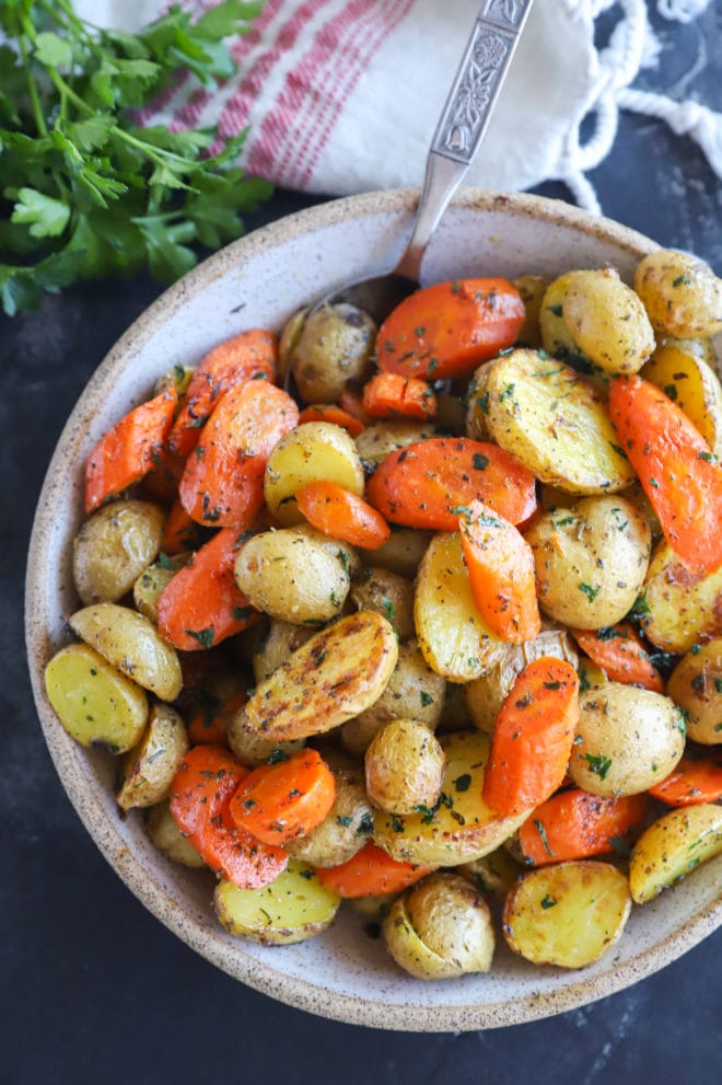 Image of oven roasted carrots and potatoes in a bowl