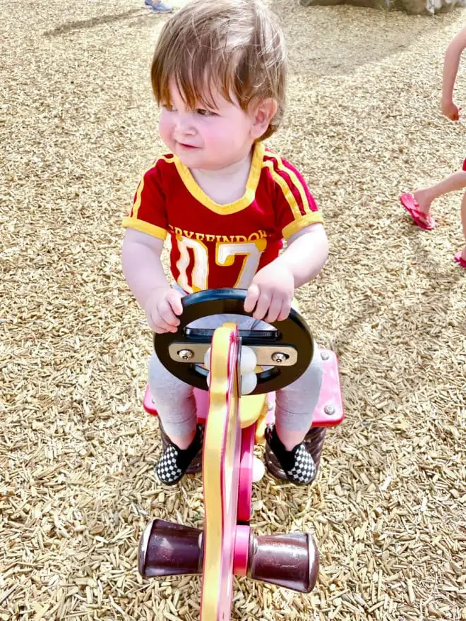 Baby in april on firetruck bouncy image