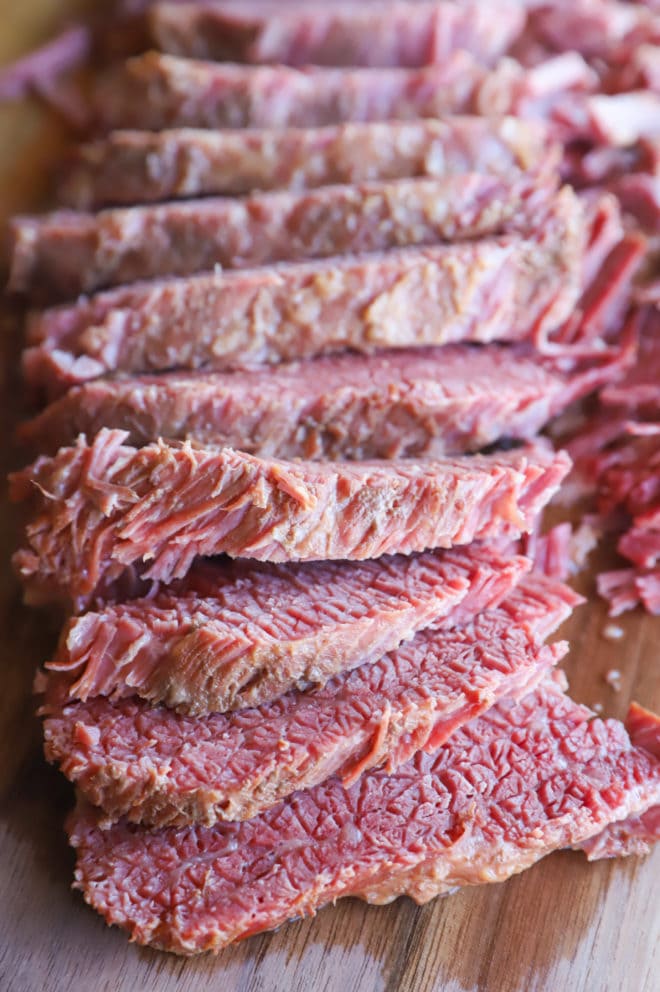 Sliced guinness corned beef on cutting board image