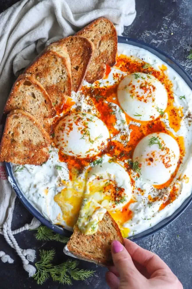 Turkish eggs overhead image with bread