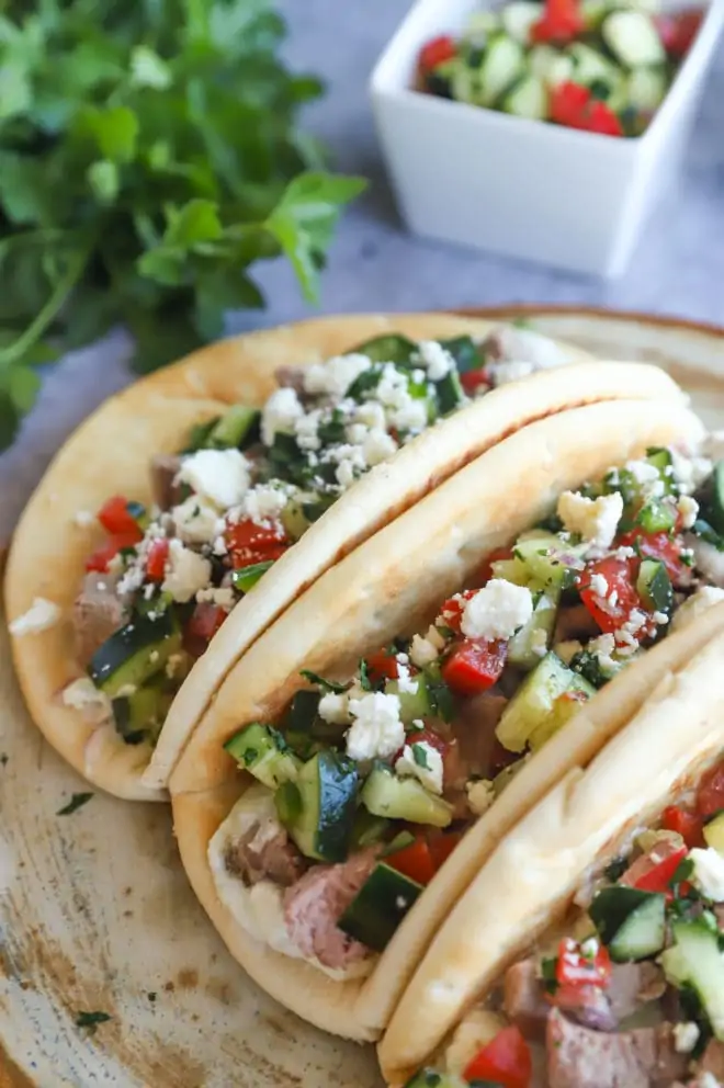 Side photo of lamb tacos on platter