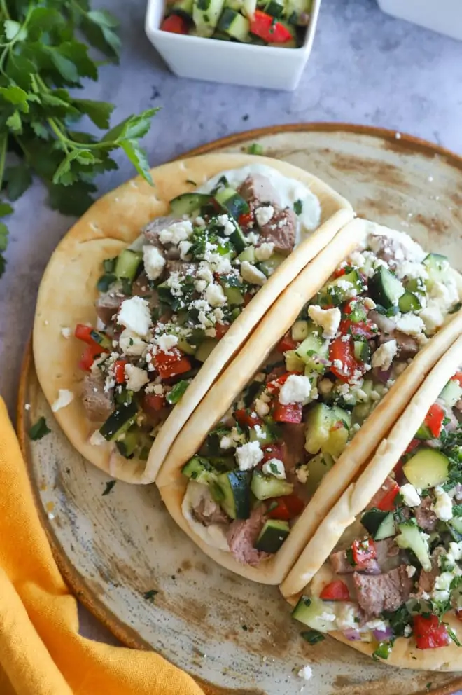 Lamb tacos image on platter with salsa