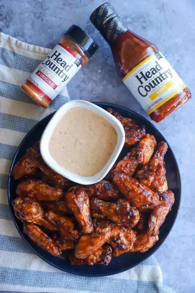 Overhead image of wings with Head Country BBQ sauce