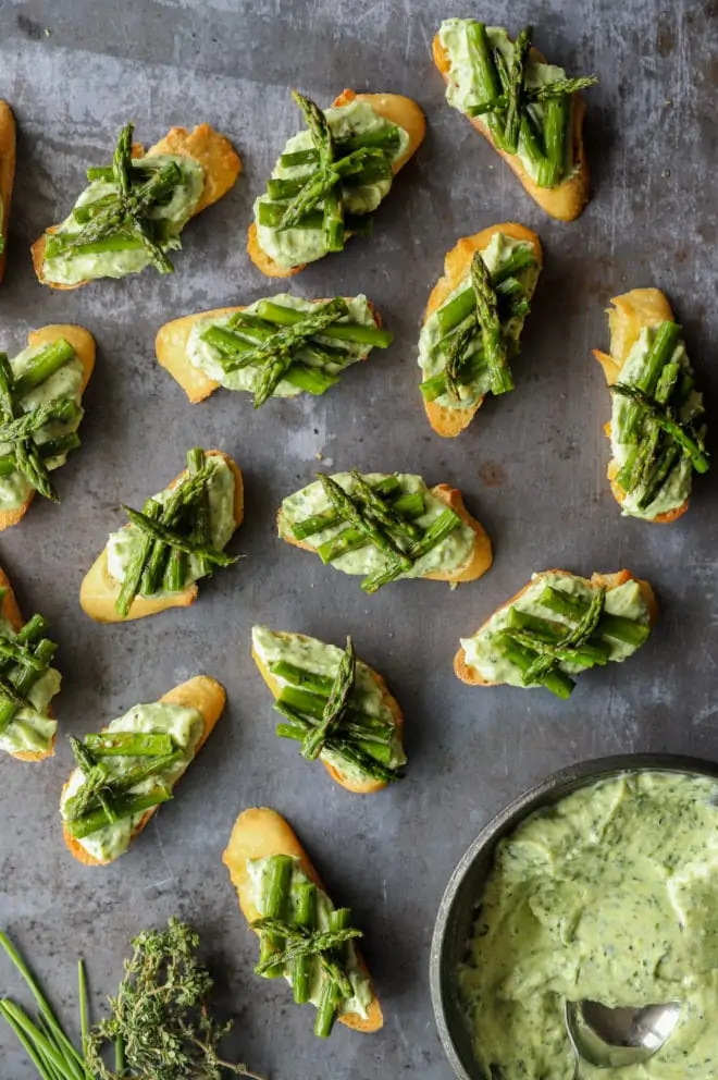 Overhead image of ricotta crostini with asparagus