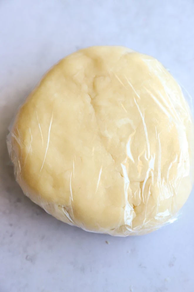 Galette dough wrapped in plastic wrap image