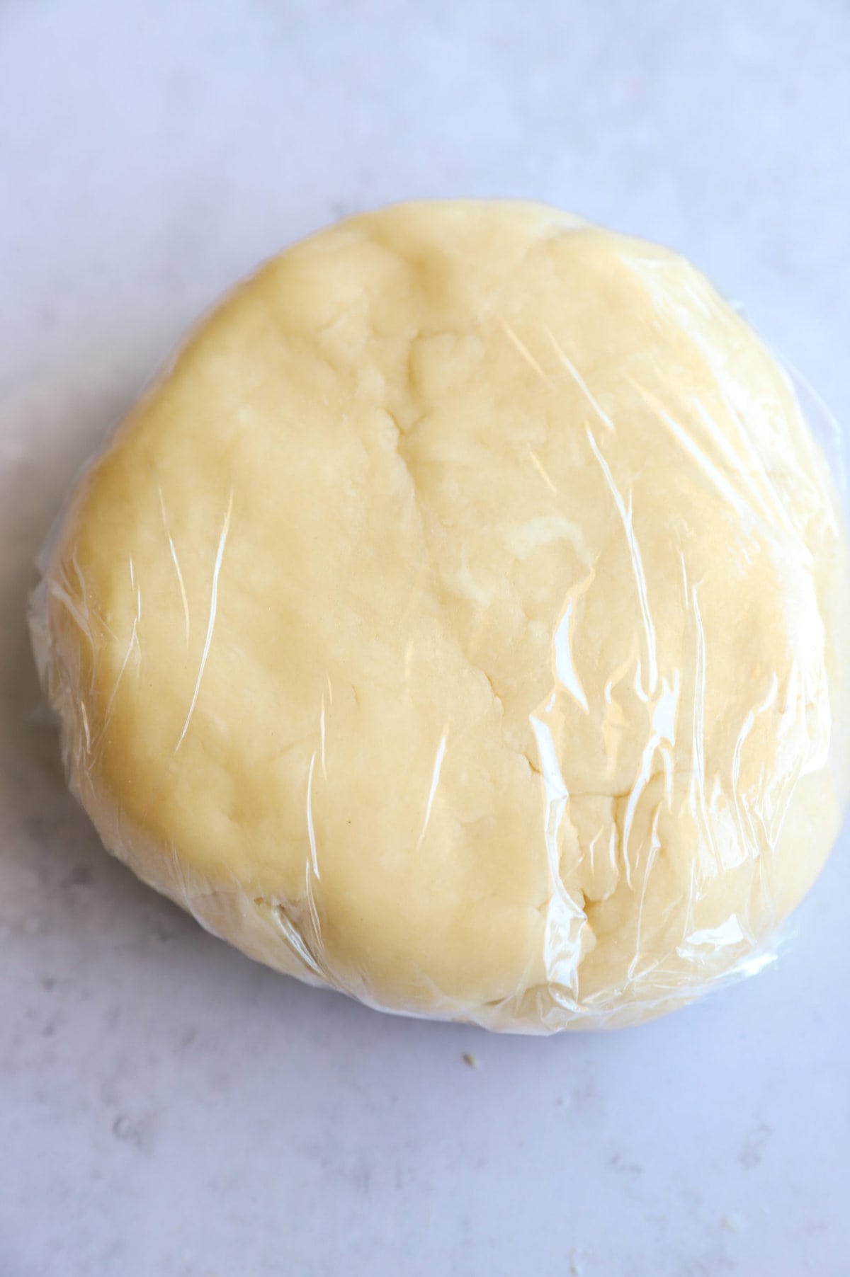 Galette dough wrapped in plastic wrap image