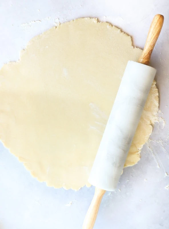 Rolling out galette dough with rolling pin pcicture