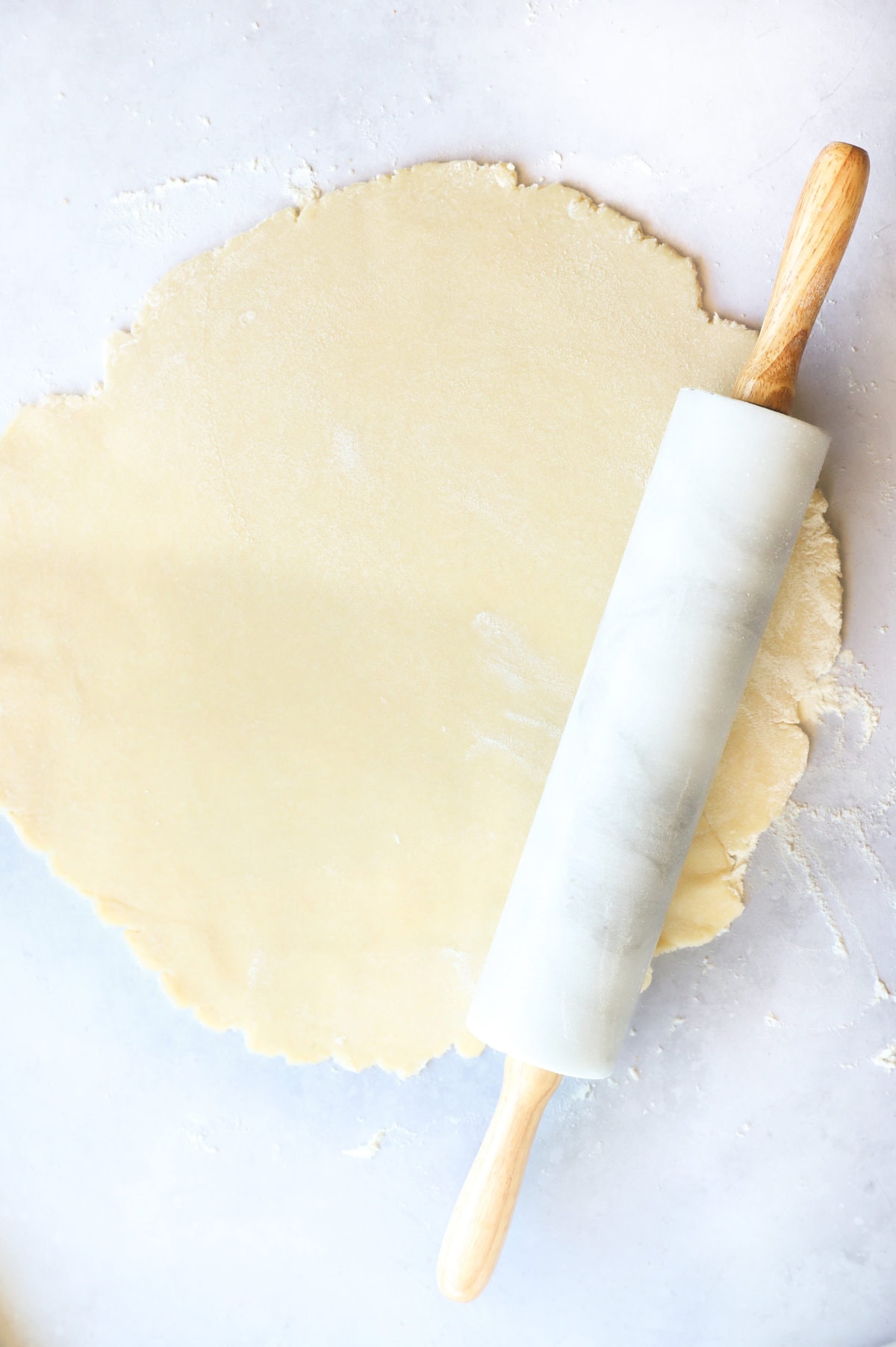 Rolling out galette dough with rolling pin pcicture