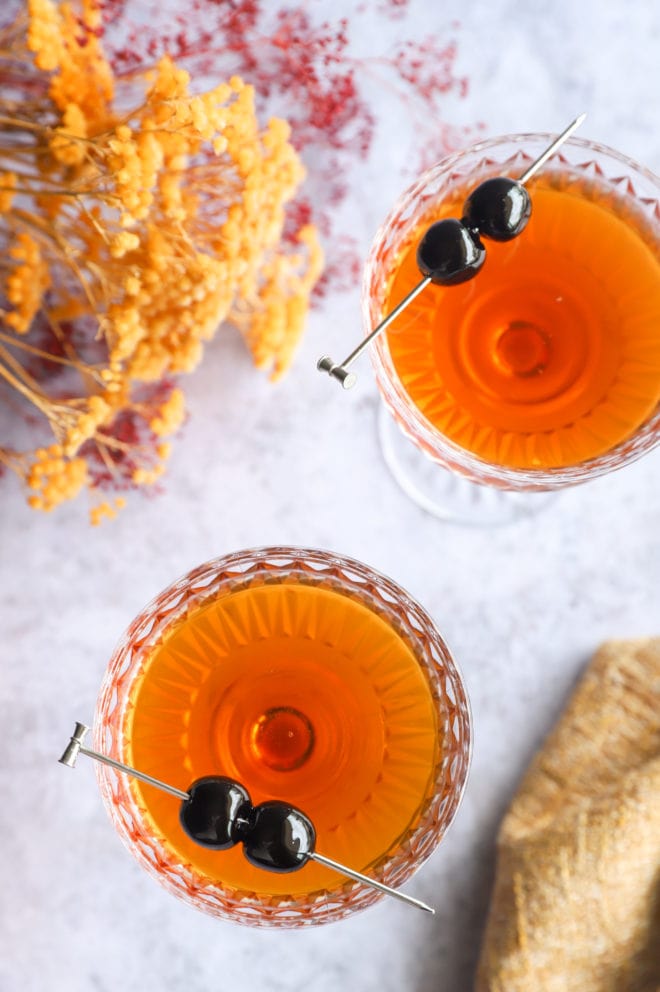 Overhead image of bourbon manhattans in coupe glasses
