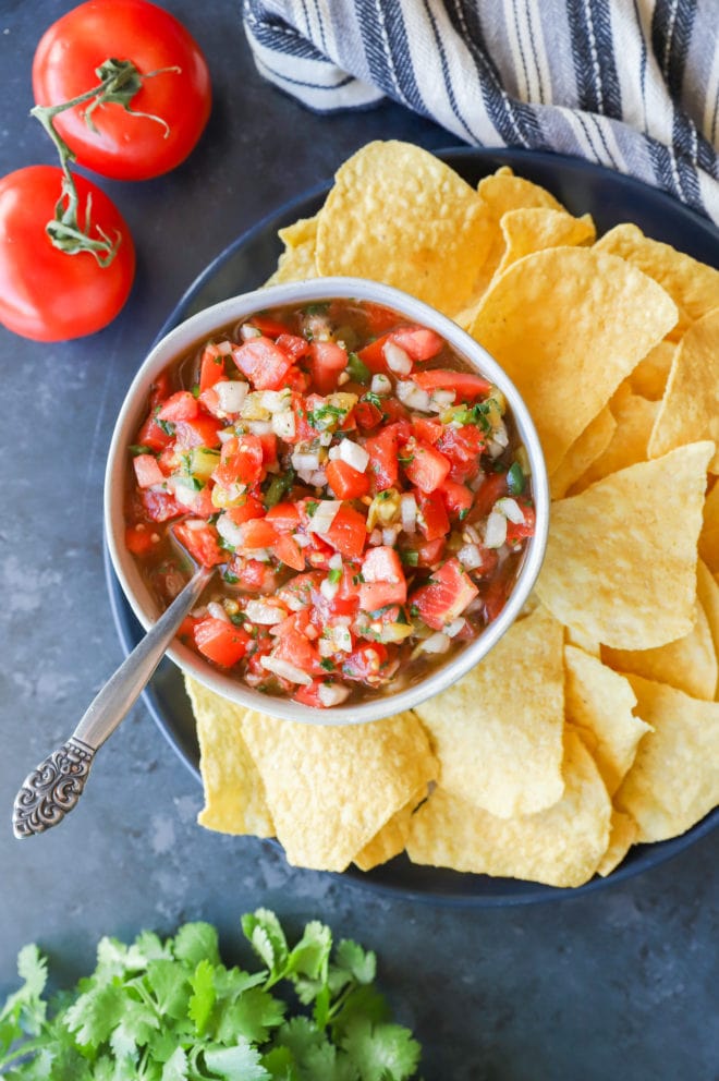 Chips and dip with spoon in bowl