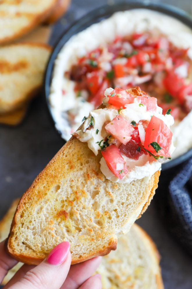 Bread slice with goat cheese dip on it