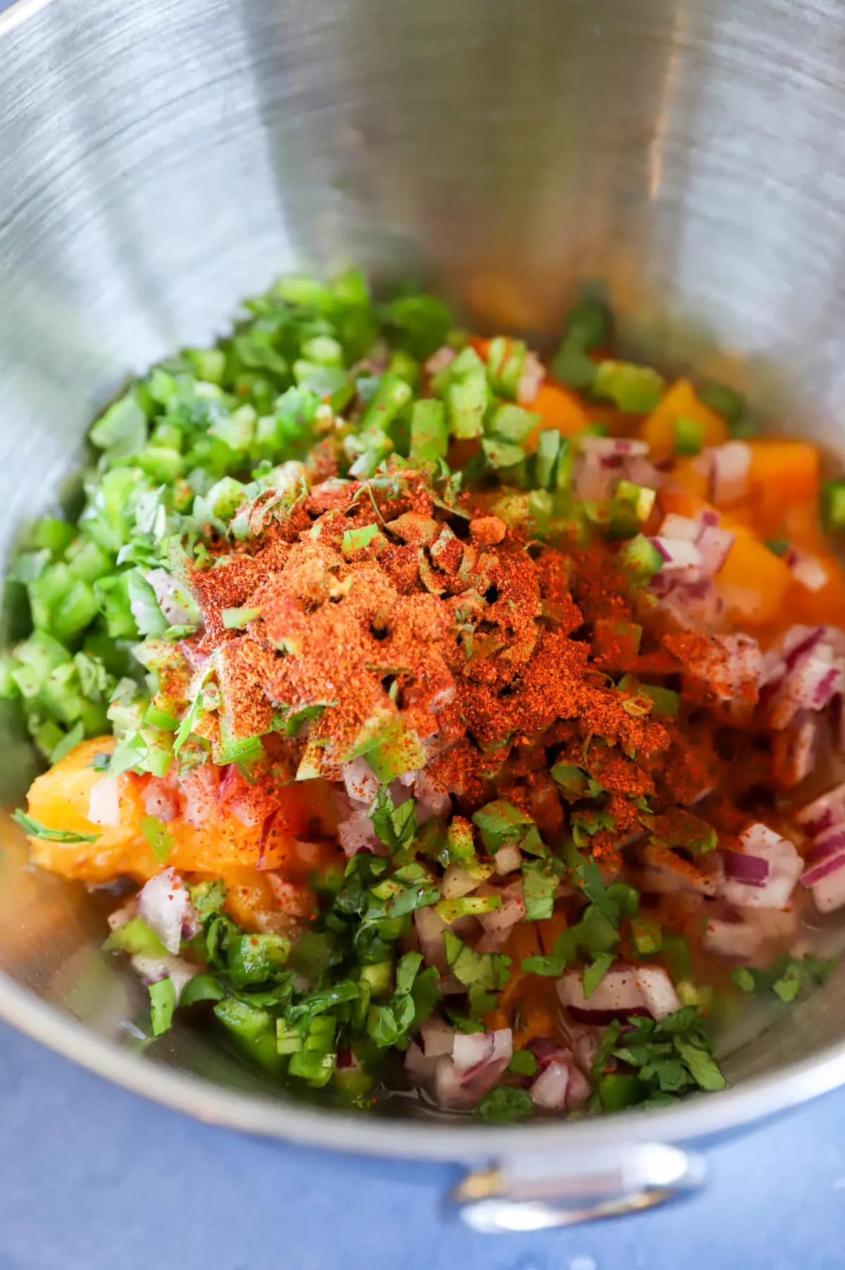 spicy bacon peach salsa ingredients in a bowl image