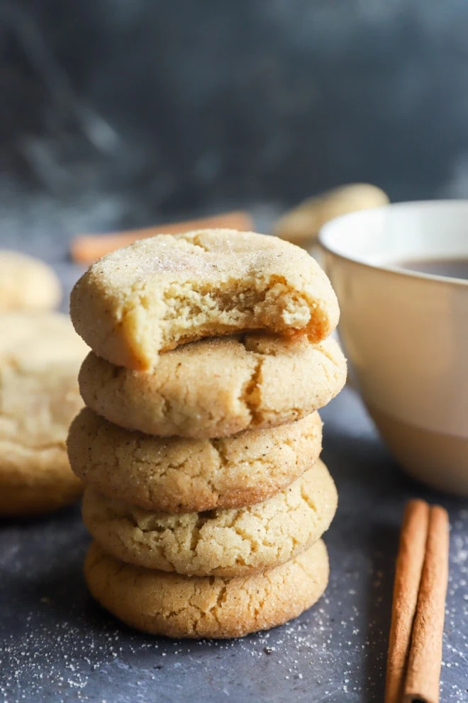 Chai snickerdoodle cookies in stack with coffee mug