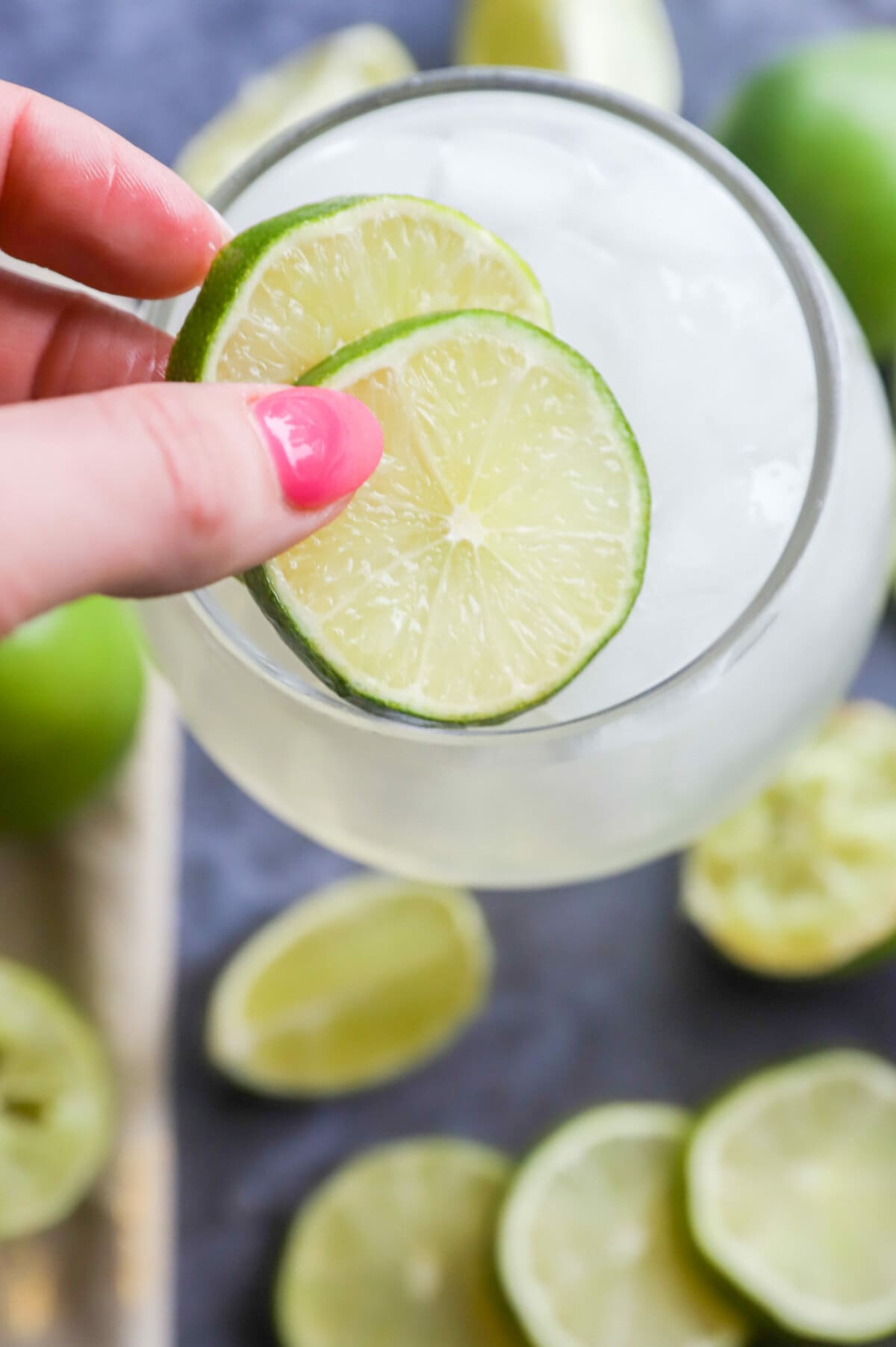 Add limes to a cocktail picture