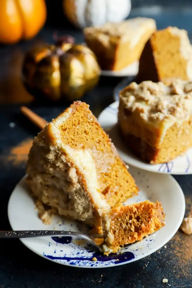 Fork of cake on a plate with pumpkin