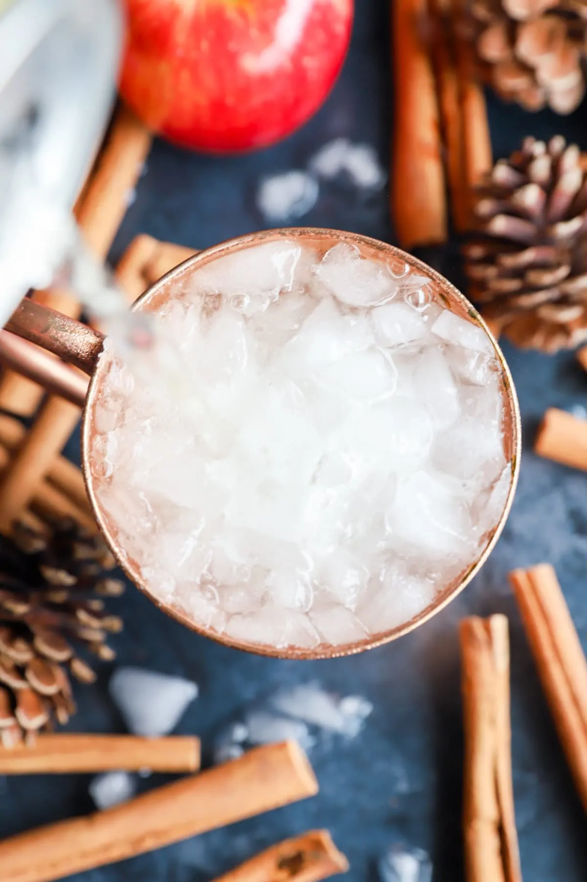 Adding ginger beer to a copper mug cocktail picture