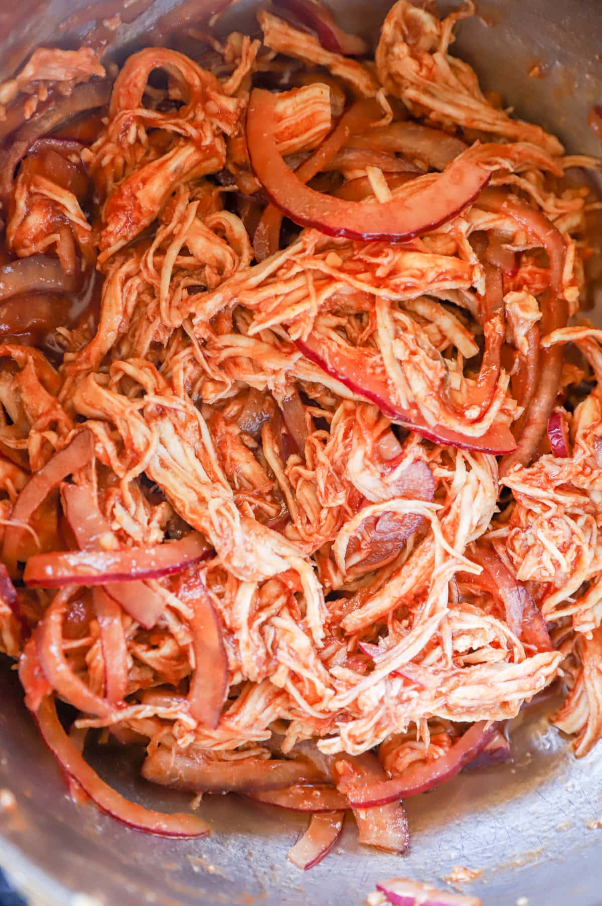Image of shredded chicken with red onion
