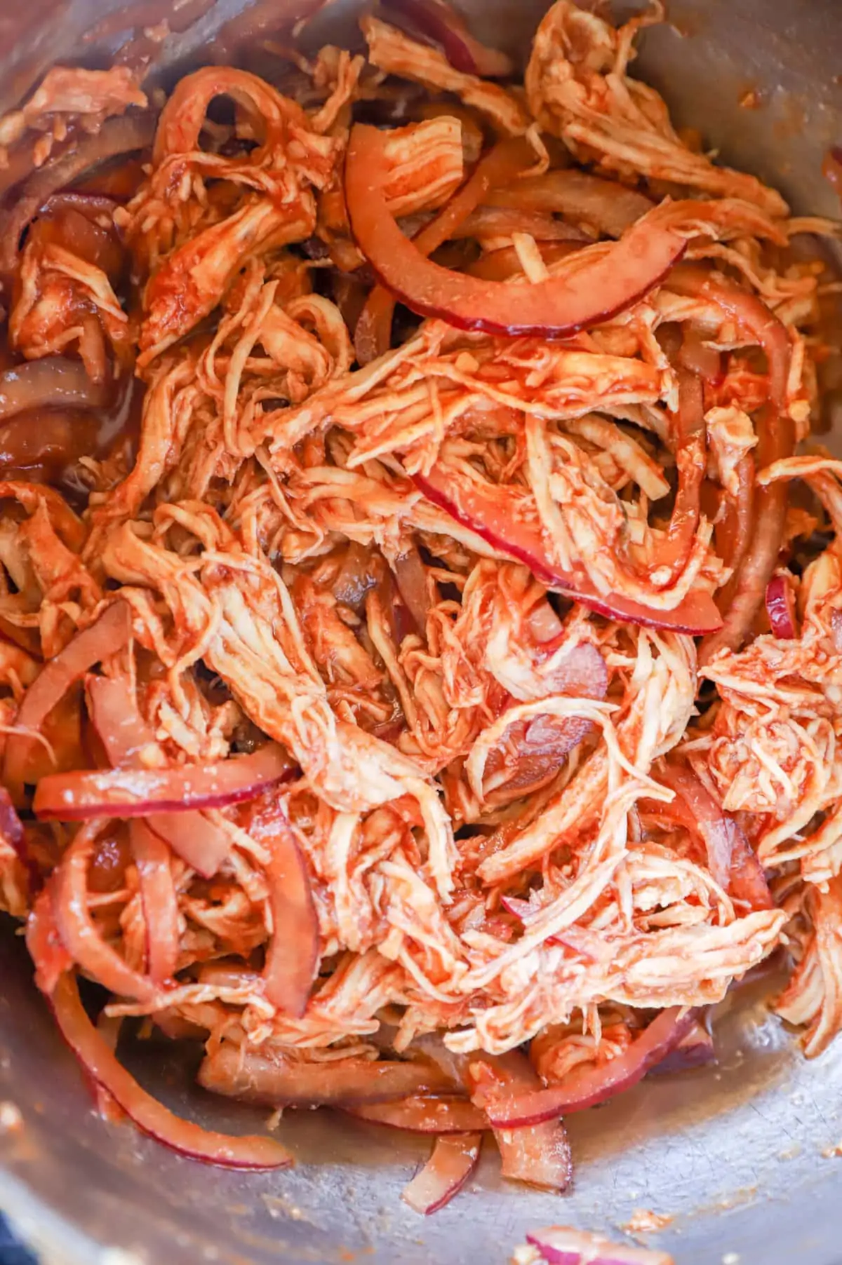 Image of shredded chicken with red onion