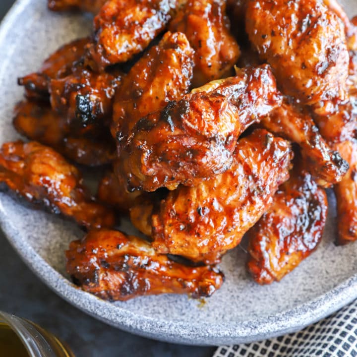 hot honey whiskey wings on a plate image