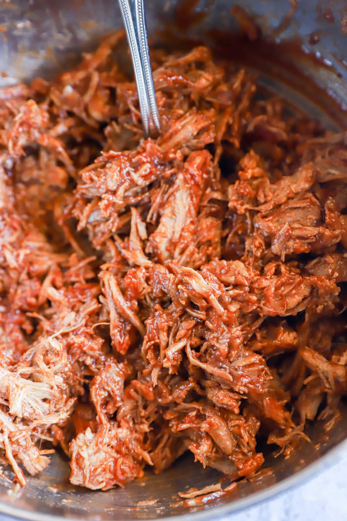 pulled pork in bowl with bbq sauce image