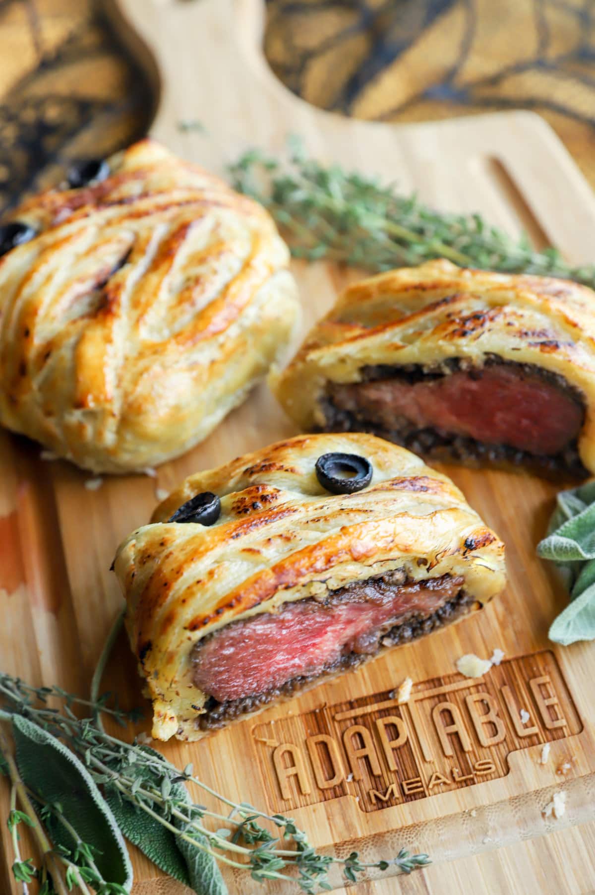 Image of beef wellington cut into on cutting board