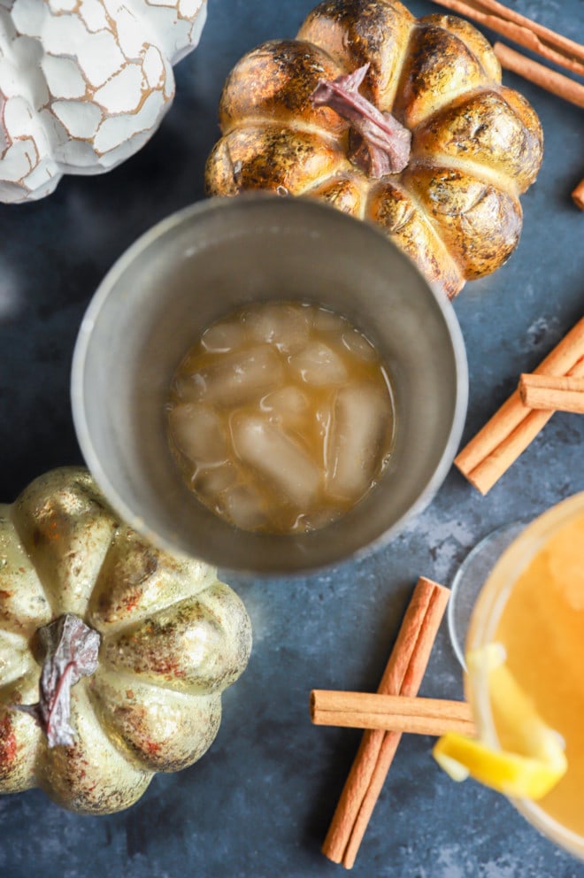 Making a pumpkin bourbon sidecar in a shaker