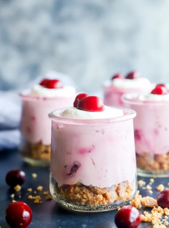 Photo of cups of holiday mousse with crumble on bottom layer