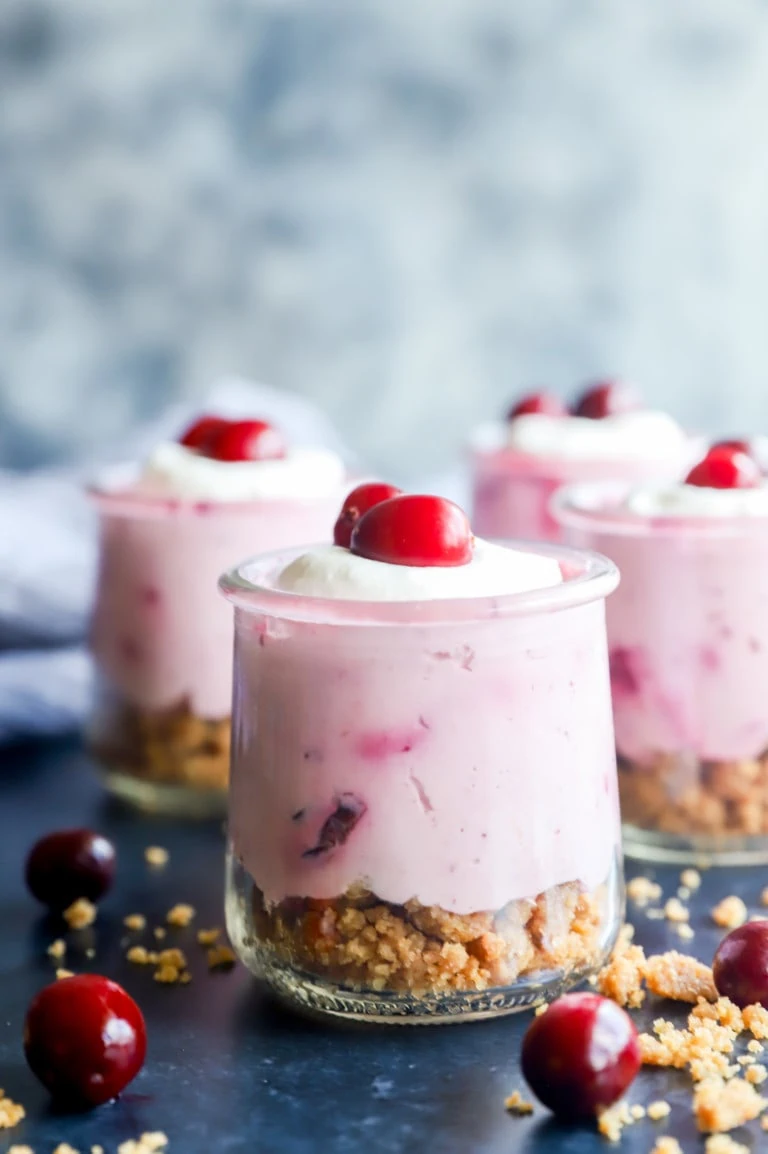 Photo of cups of holiday mousse with crumble on bottom layer