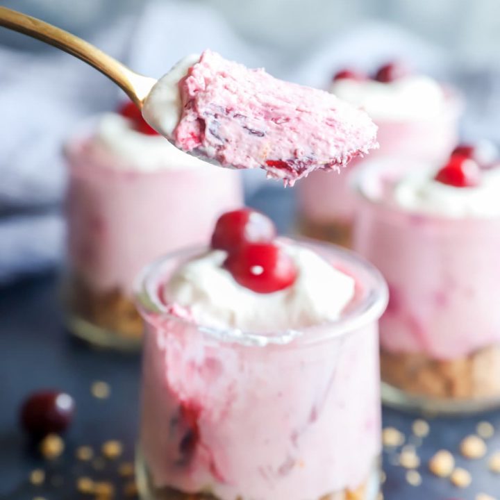 Spoonful of cranberry cheesecake mousse from jar