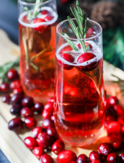 Cranberry mimosa image with champagne flutes