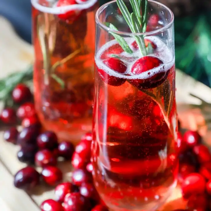 Cranberry mimosa image with champagne flutes